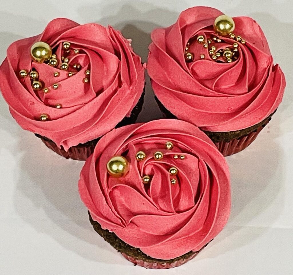 rose iced cupcakes with gold balls
