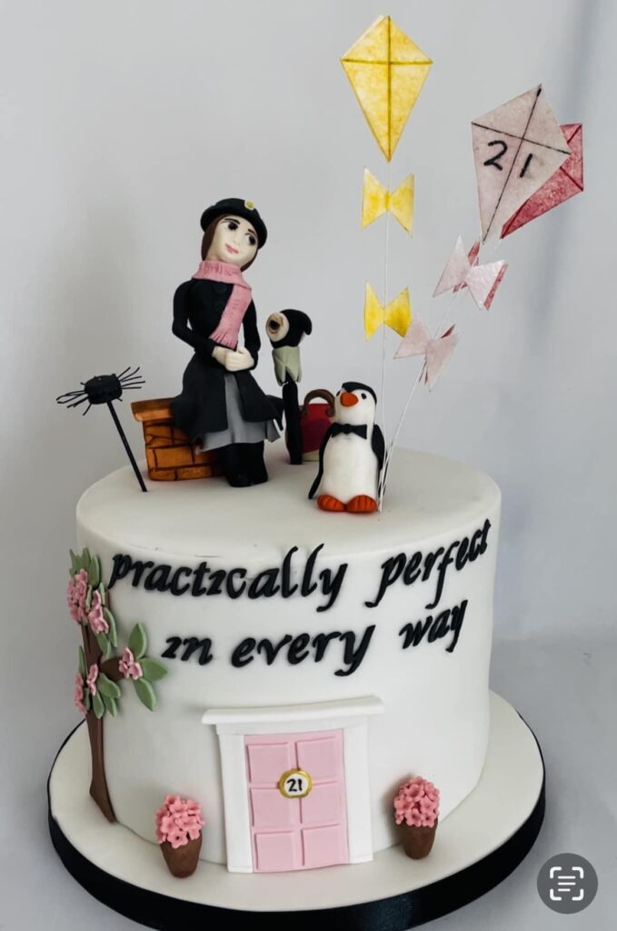 children's cake of Mary Poppins and kites on an iced cake