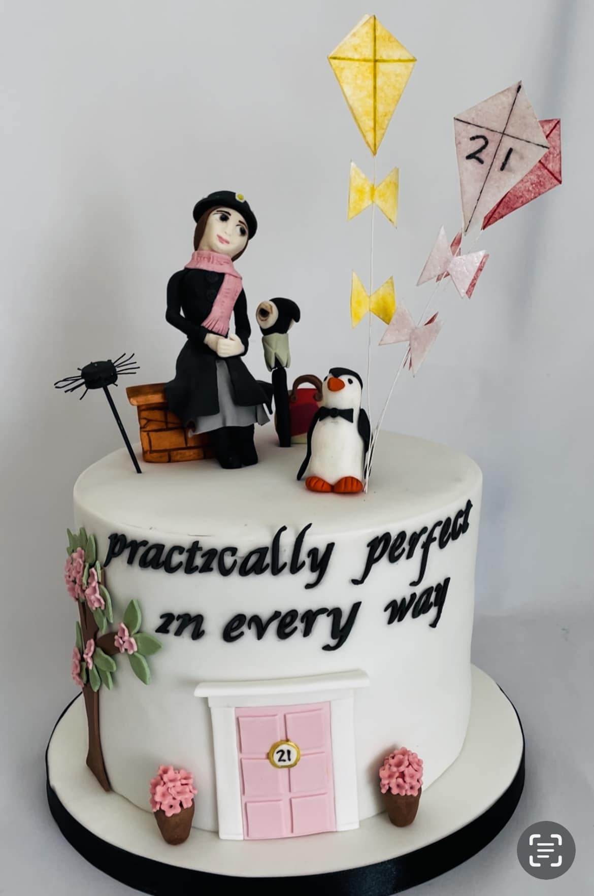 Mary Poppins cake with penguin and kites flying 